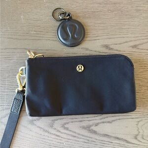 Lululemon black wristlet and black leather key ring.